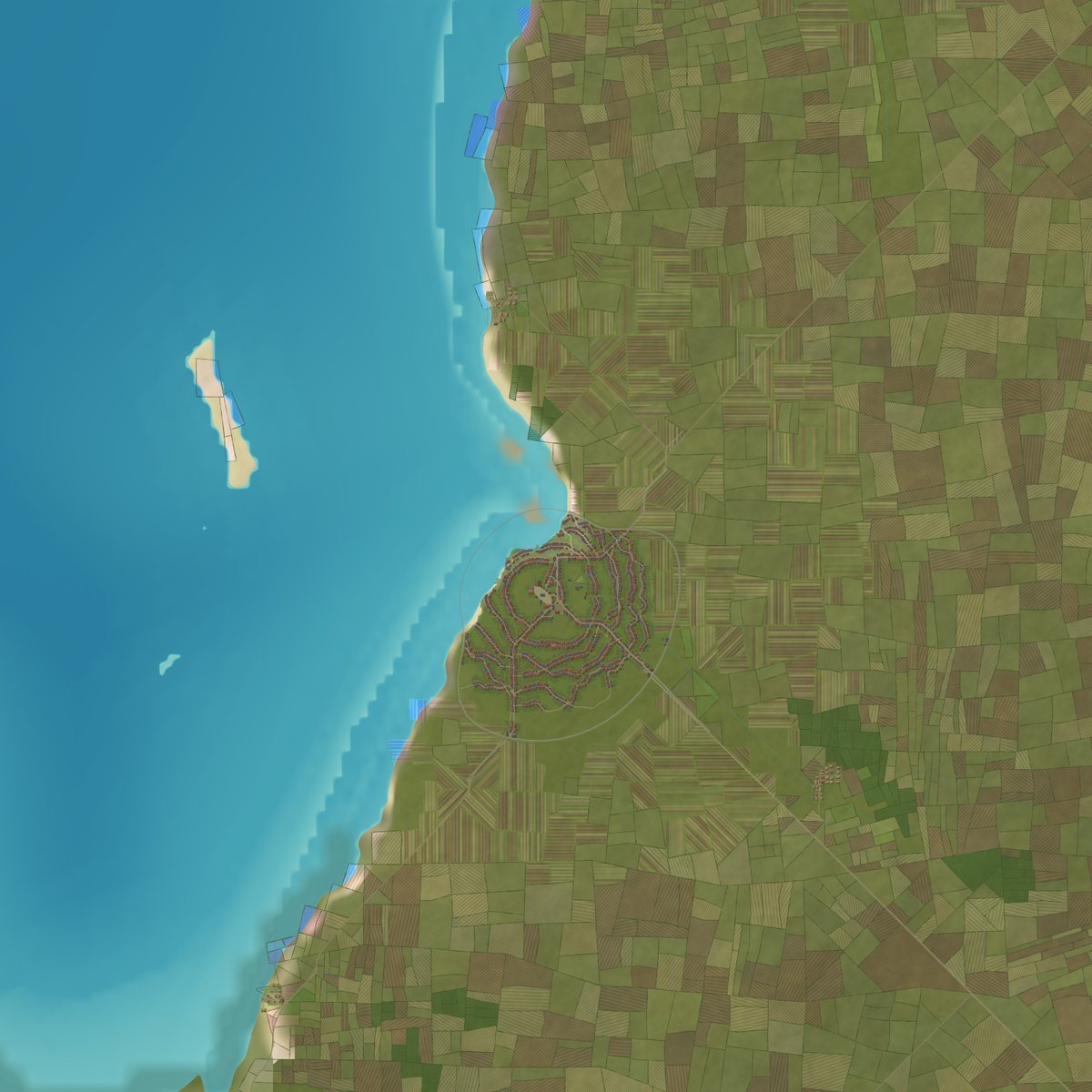 A coastal town with its fields, walls and roads seen from above